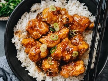 Crispy sesame chicken over steamed rice