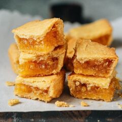 A simplified Taiwanese pineapple cake featuring a buttery crumbly dough filled with a fragrant tangy pineapple filling. Compared to the traditional method, this one does not require a special mold, so it is much easier to make, and it tastes even better. Make them in your own kitchen to enjoy as a tea snack or a special edible gift. {Vegetarian}