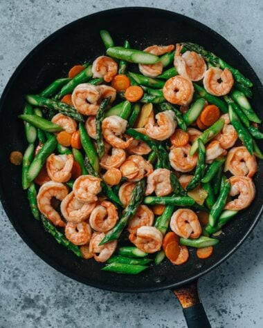 Shrimp and asparagus stir fry in a pan