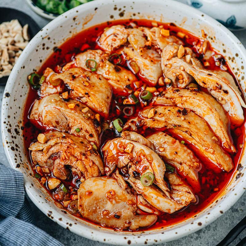 Experience the authentic flavors of Sichuan cuisine with this mouth-watering recipe for saliva chicken. The dish features tender juicy chicken smothered in a rich and spicy sauce that is bursting with umami, just like the one served in China.