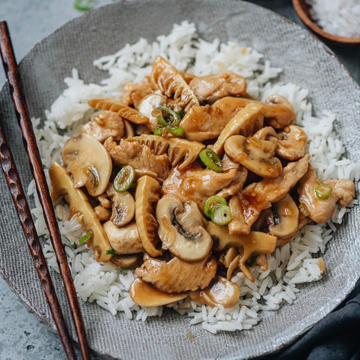 Chinese mushroom chicken is very easy to make and perfect for a weekday dinner. The tender chicken bites are cooked in an aromatic savory sweet sauce with juicy mushrooms and crisp bamboo shoots. Serve it over steamed rice and you&rsquo;ll have your dinner ready in no time. {Gluten-Free adaptable}