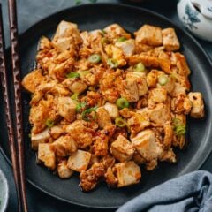 Egg and tofu stir fry is a super easy one-pot meal that is hearty, rich in flavor, and full of nutrition. The tender silken tofu is cooked with scrambled eggs and finished up with a fragrant sauce that&rsquo;s savory, slightly sweet, and spicy. Serve it by itself or over rice for a quick and satisfying meal! {Vegetarian adaptable, gluten-free adaptable}