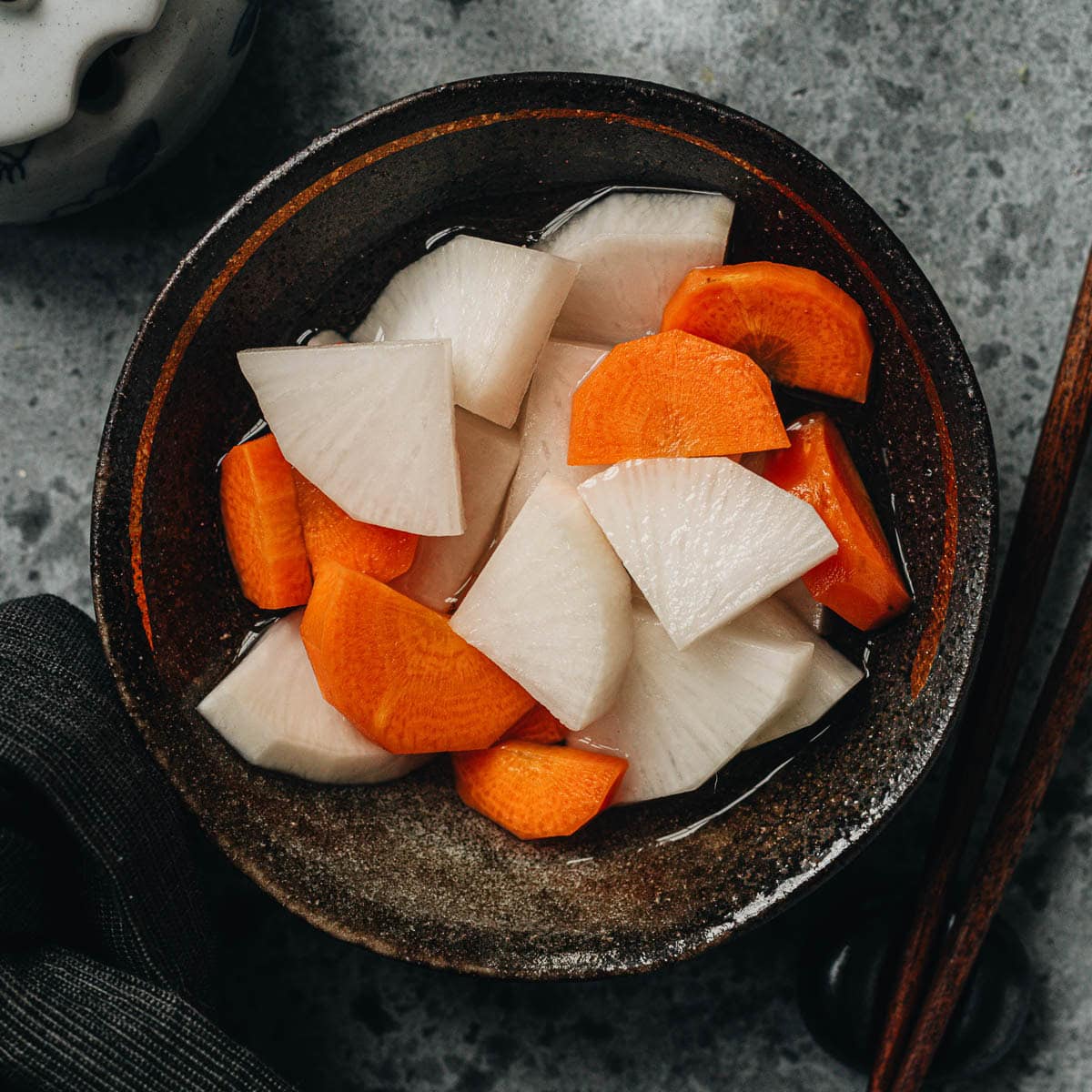 Make this tangy and crunchy pickled daikon and carrot to pique your appetite and start your meal. It&rsquo;s a quick pickle recipe that takes no time to put together. {Gluten-Free, Vegan}