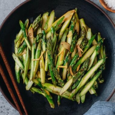 The asparagus stalks are sliced and stir fried in an aromatic oil infused with ginger and garlic, then finished with lemon juice. It&rsquo;s a Chinese-inspired side dish that is quick to make and adds color to your dinner table. {Vegan, Gluten-Free}