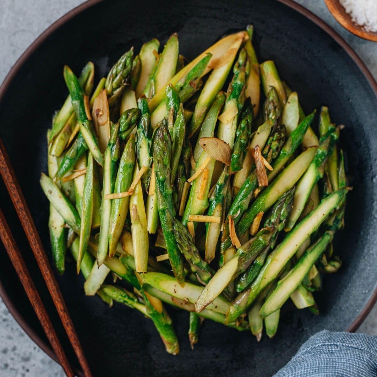 The asparagus stalks are sliced and stir fried in an aromatic oil infused with ginger and garlic, then finished with lemon juice. It&rsquo;s a Chinese-inspired side dish that is quick to make and adds color to your dinner table. {Vegan, Gluten-Free}