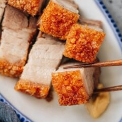 An air fryer siu yuk recipe that guarantees perfectly puffed up pork skin that is super crispy, without tough spots. The meat is juicy and extra flavorful thanks to the marinade. Look no further if you want to recreate this dim sum classic in your own kitchen.