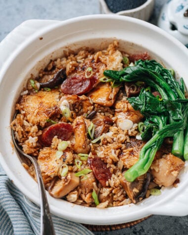Homemade claypot rice with chicken, sausage, mushrooms and gai lan