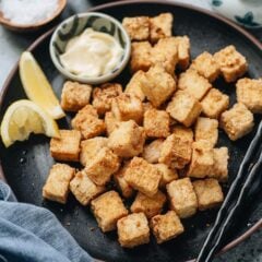 These air fryer tofu bites are extra crunchy and crispy, tossed with a delicious pepper salt spice mix. It&rsquo;s a perfect snack or appetizer served by itself, or a great topping for your rice and salad bowls. {Vegetarian, Gluten-Free Adaptable}
