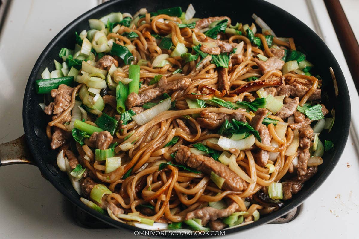 Toss the noodles to finish up the dish