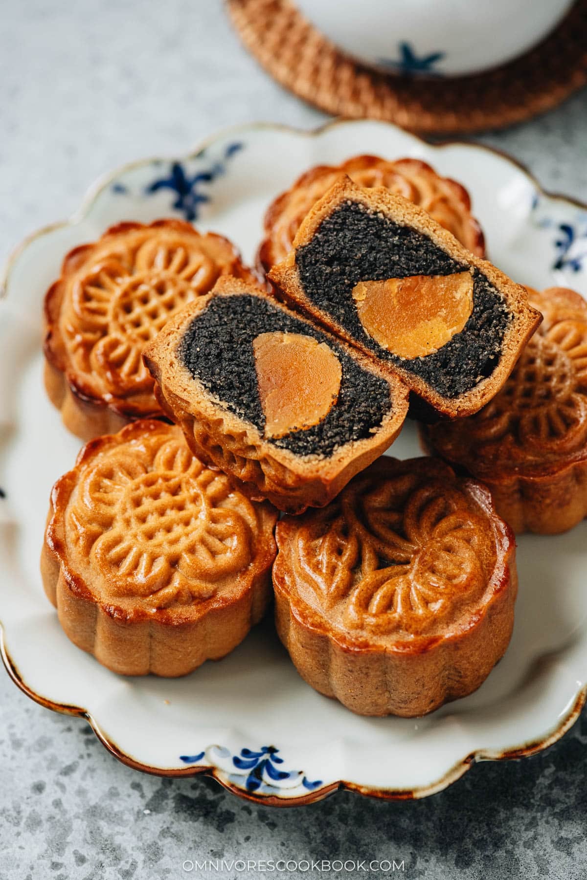 Homemade traditional mooncake with black sesame and salted duck egg yolk filling