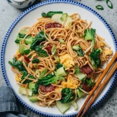 My easy fried noodles make a quick, comforting meal with chewy noodles, crisp bok choy, savory Chinese sausage, and soft scrambled eggs. Everything comes together in under 20 minutes for a satisfying dish that&rsquo;s simple yet full of flavor.