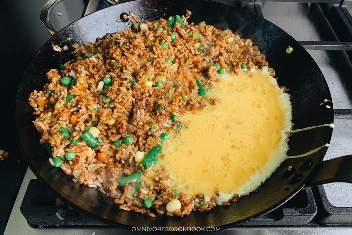 beaten eggs into the pan with rice mixture