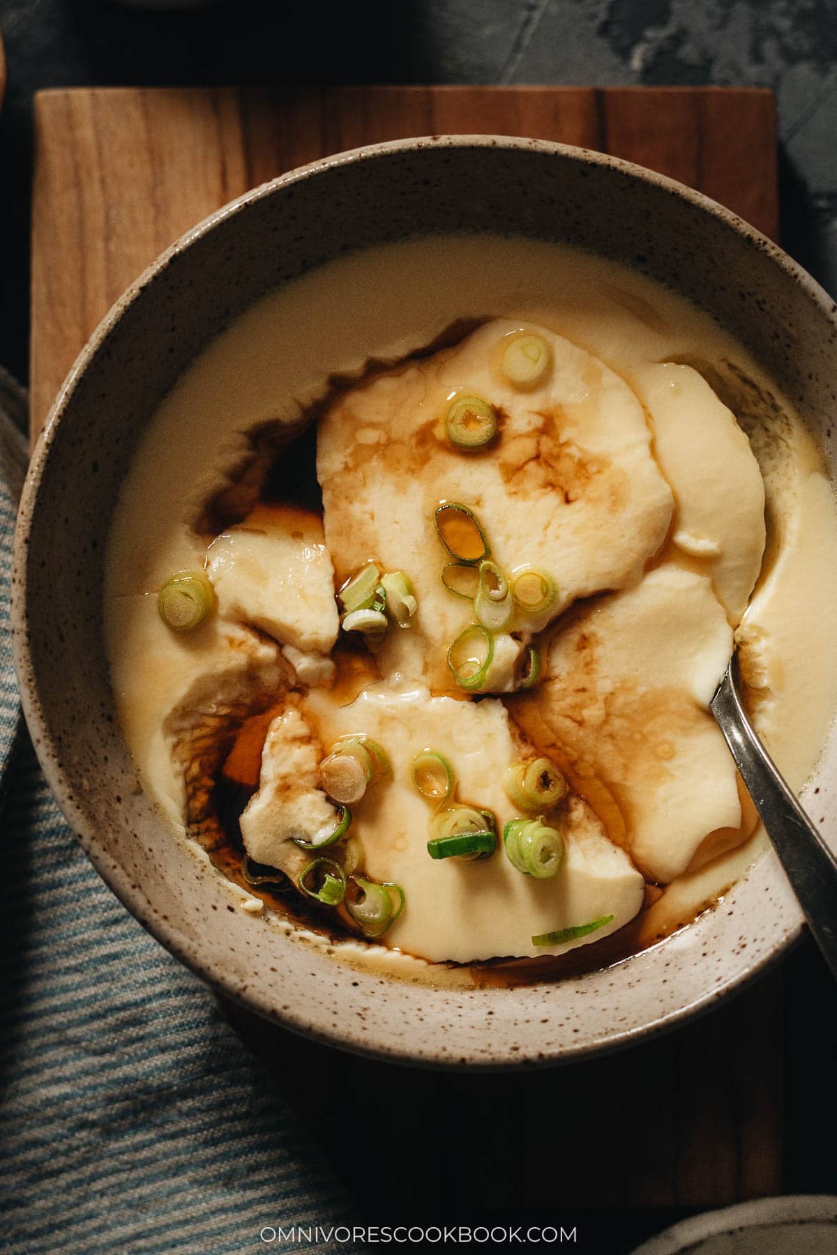 Chinese steamed eggs in a bowl with a spoon