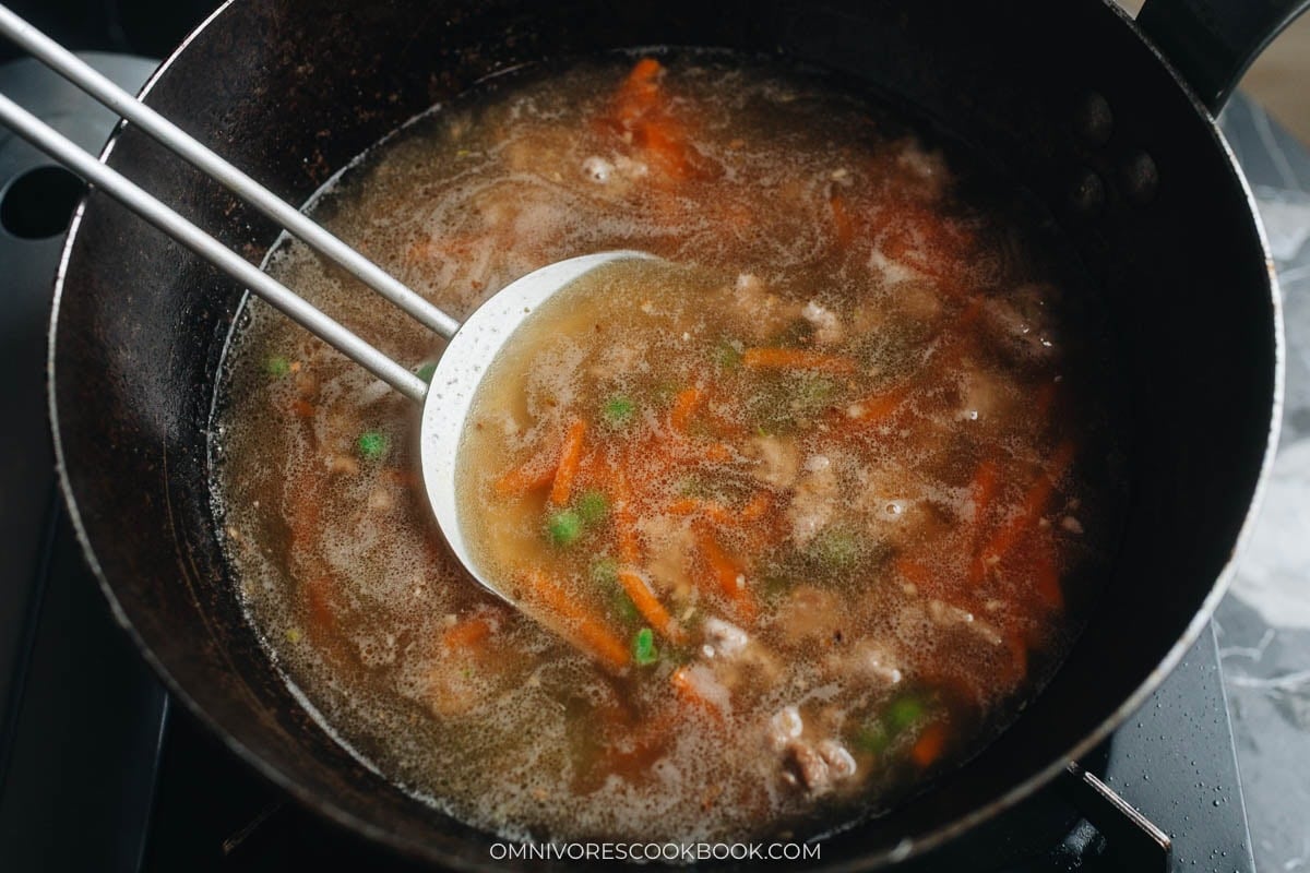 sauce and vegetables in a wok