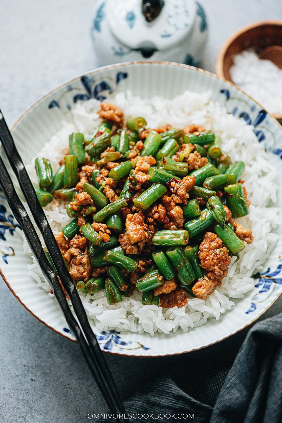 Green beans and ground pork stir fry served over steamed rice