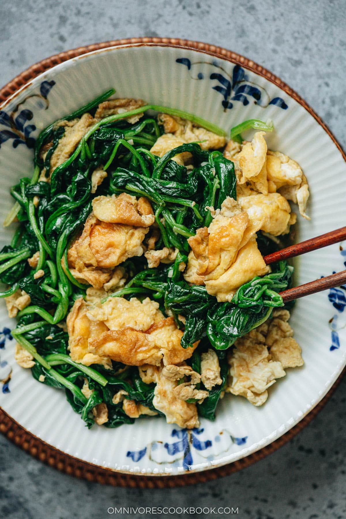 Spinach and scrambled eggs stir fry close-up