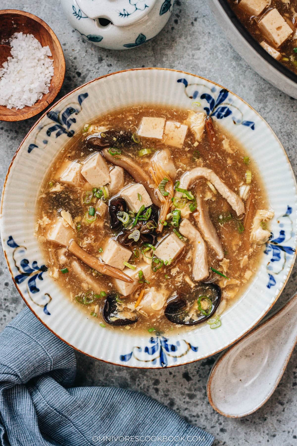 Hot and Sour Soup (酸辣汤) - Authentic Chinese restaurant-style hot and sour soup made easy. The hearty broth is loaded with veggies and is so satisfying and healthy. The recipe includes notes on how to tweak the soup into a vegetarian one and to use whatever veggies you have on hand. #takeout #recipes #traditional Homemade hot and sour soup in bowls