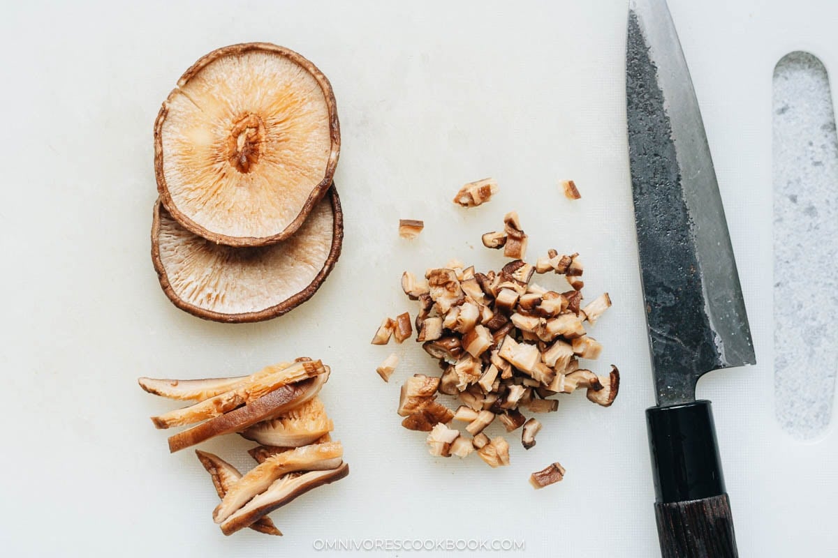 chopping the shitake mushrooms