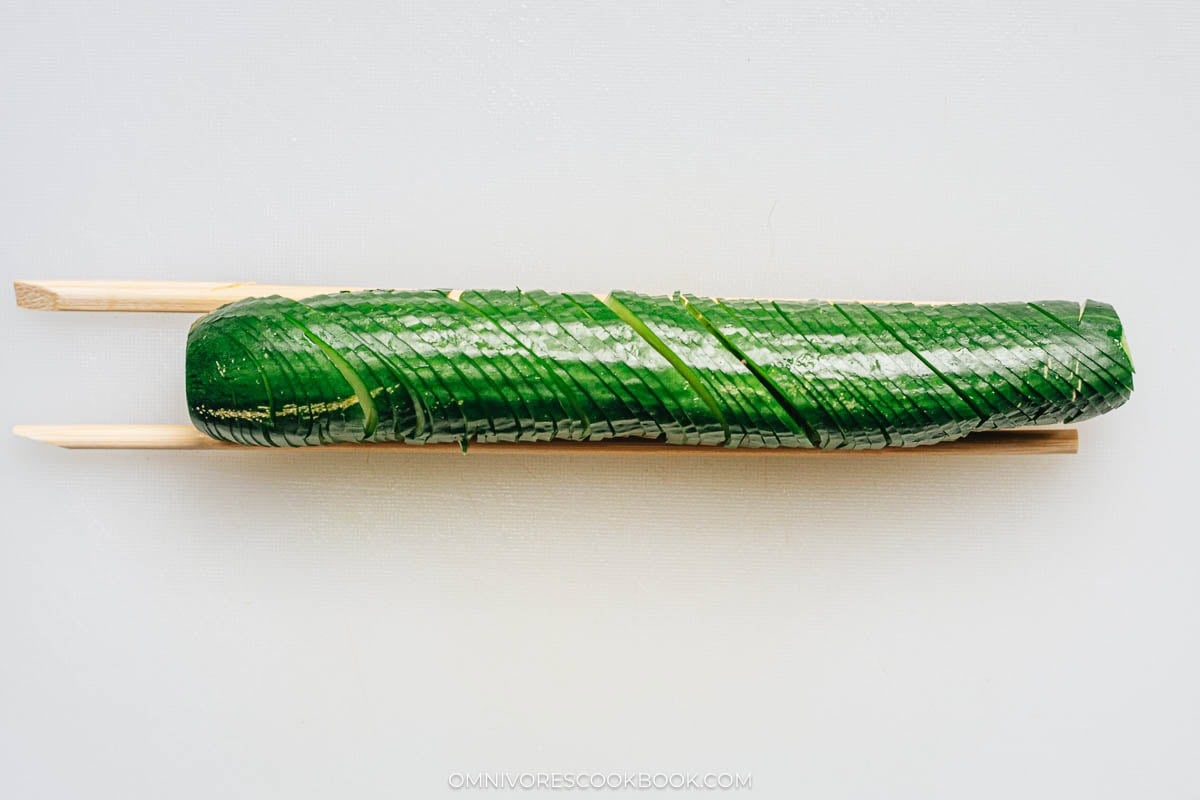 pair of chopsticks on the sides of the cucumber