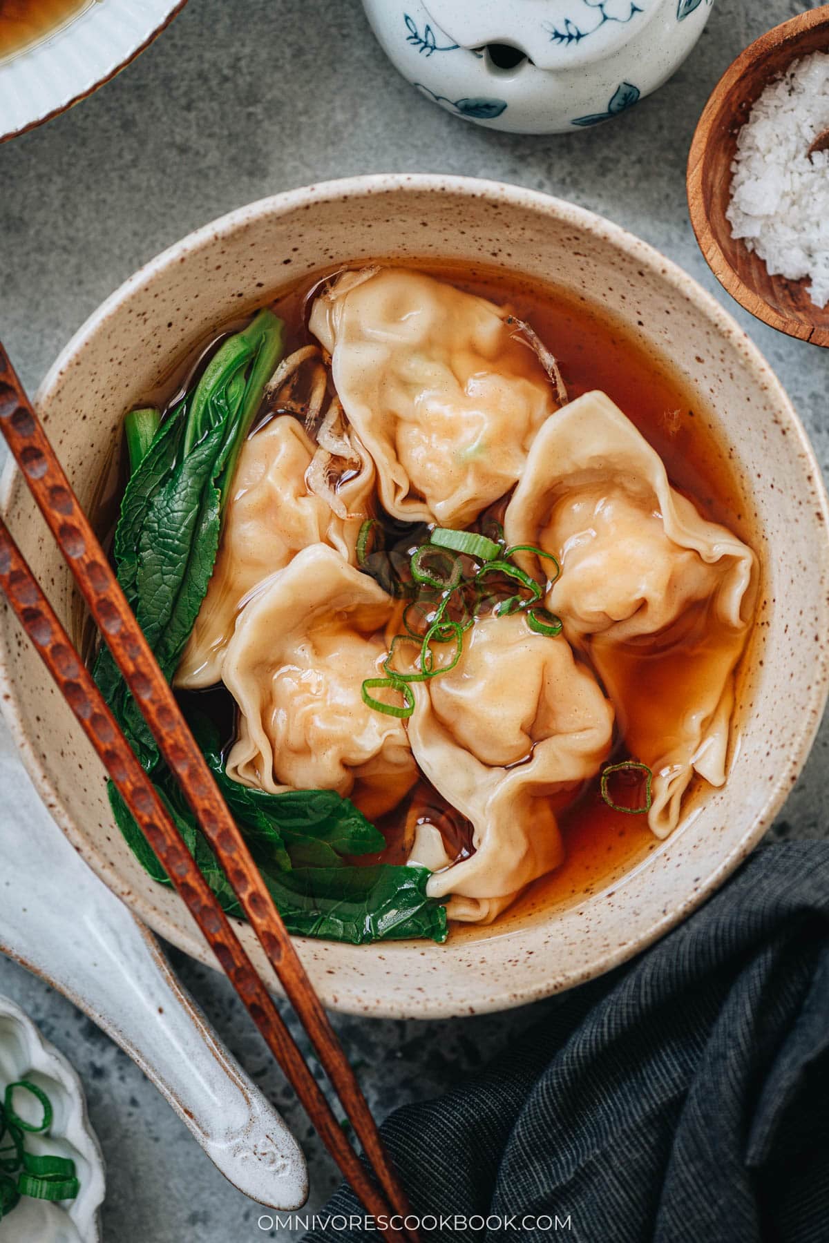 Bowl of shrimp wonton soup with wontons in clear broth