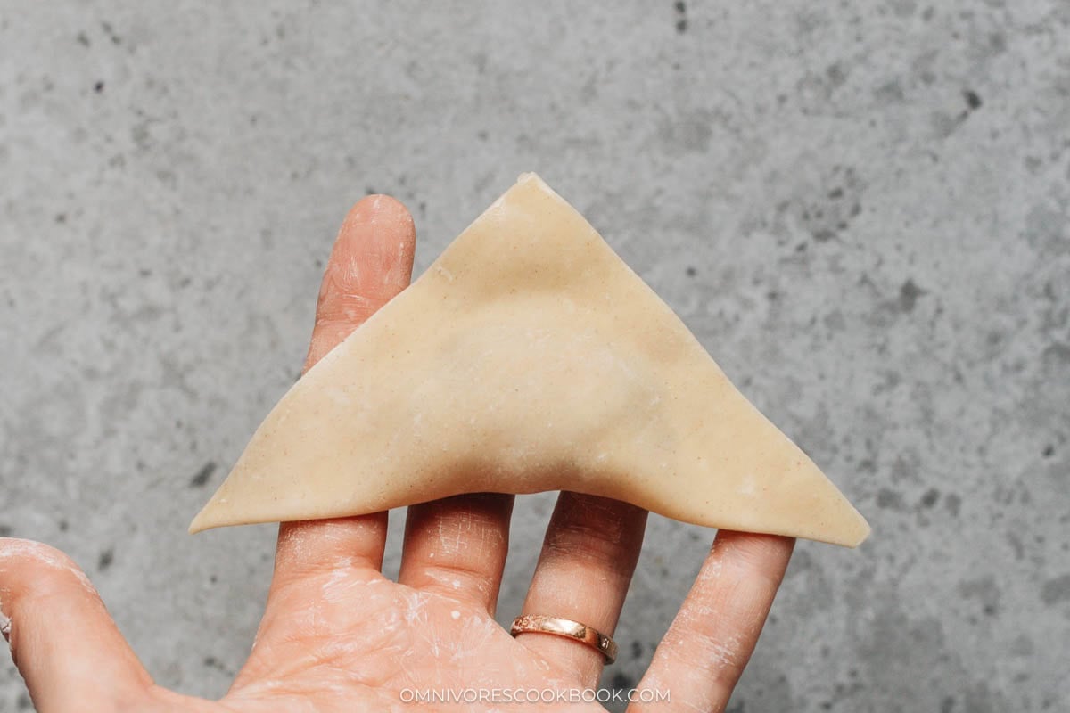 Wonton wrapper folded into triangle