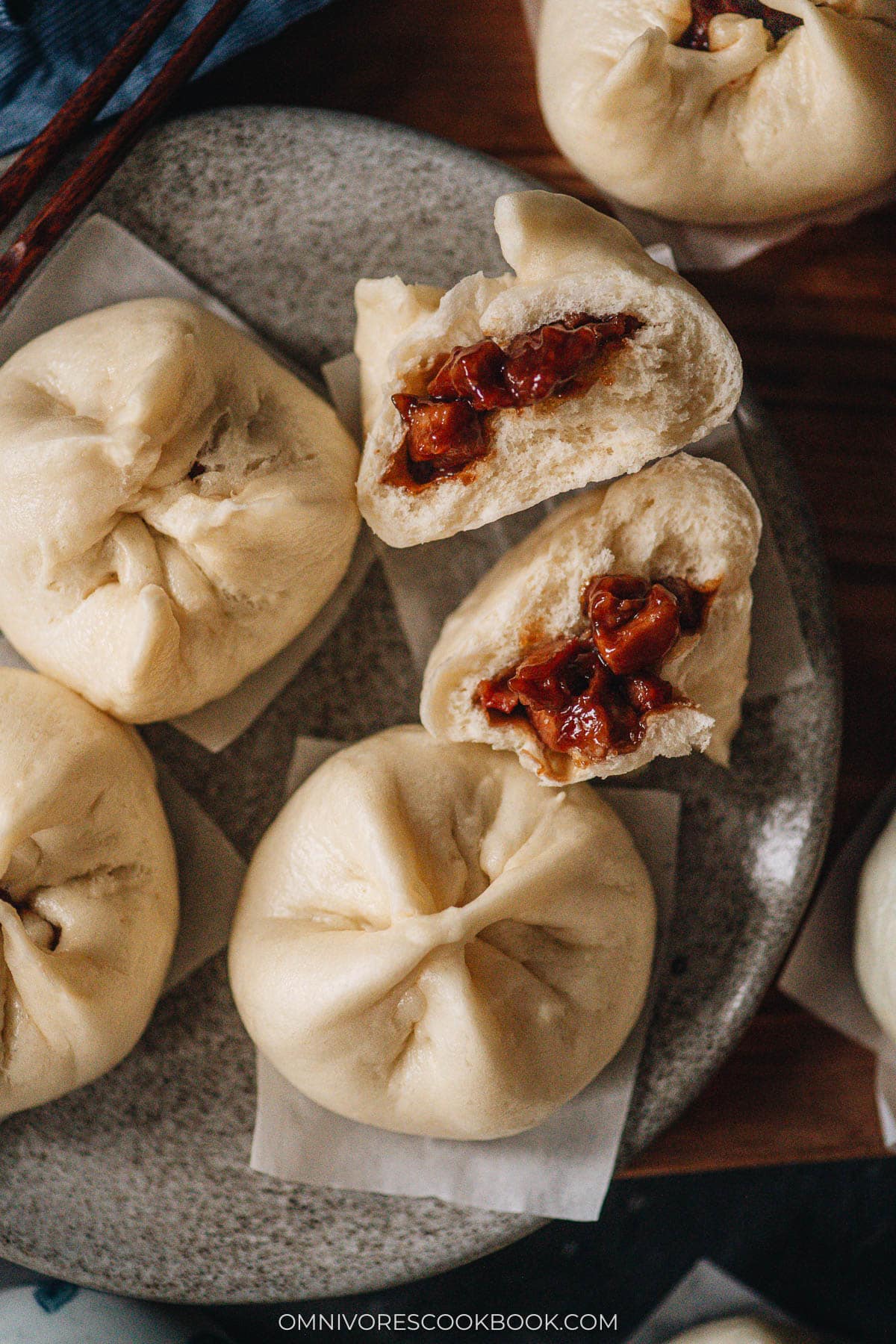 Char Siu Bao (Steamed BBQ Pork Buns) | Learn how to make authentic Chinese char siu bao just like a dim sum restaurant. The buns have very soft, fine, and fluffy bread with a juicy tender pork filling. My recipe includes detailed step-by-step photos and a video to help you achieve the best result in your own kitchen. Char siu bao close-up