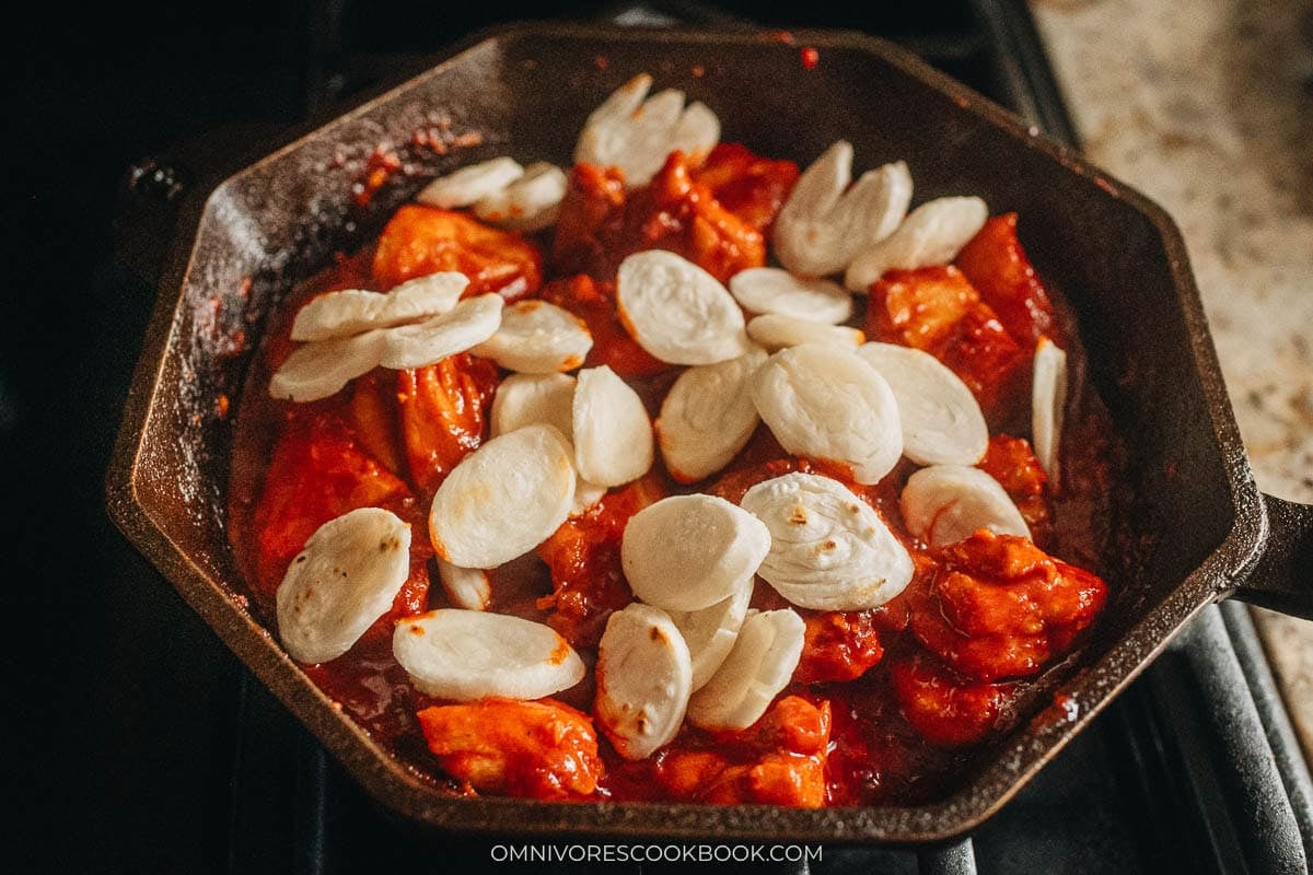 Adding back the rice cakes to pan