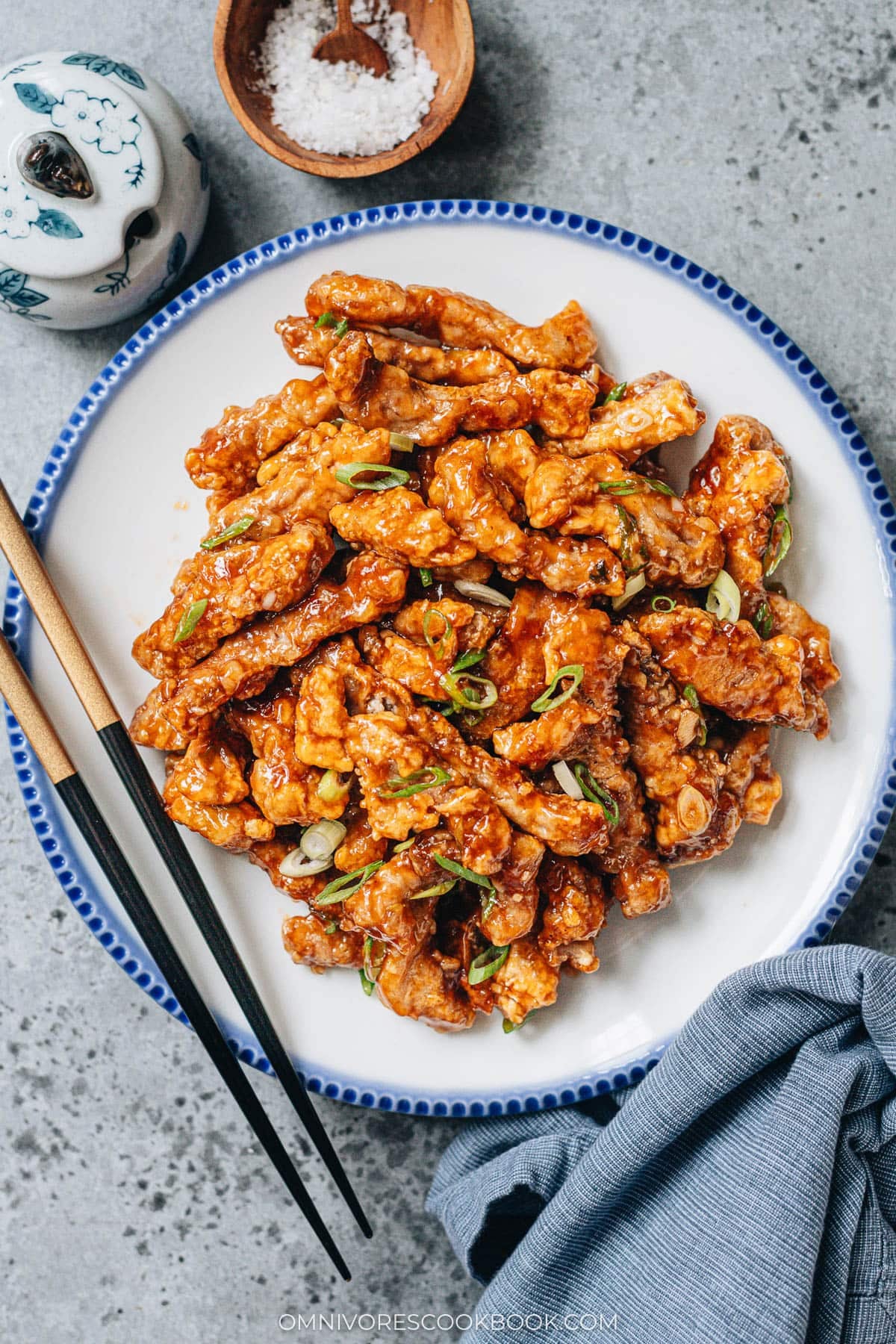 Sweet and Sour Pork (糖醋里脊) | Introducing the authentic Chinese sweet and sour pork made with lightly battered pork, pan-fried until crispy, juicy, and tender, then tossed in a fragrant sticky sauce with a perfectly balanced sweet and sour taste. It’s super easy to make and tastes way better than takeout! {Gluten-free Adaptable} Sweet and sour pork in a pan